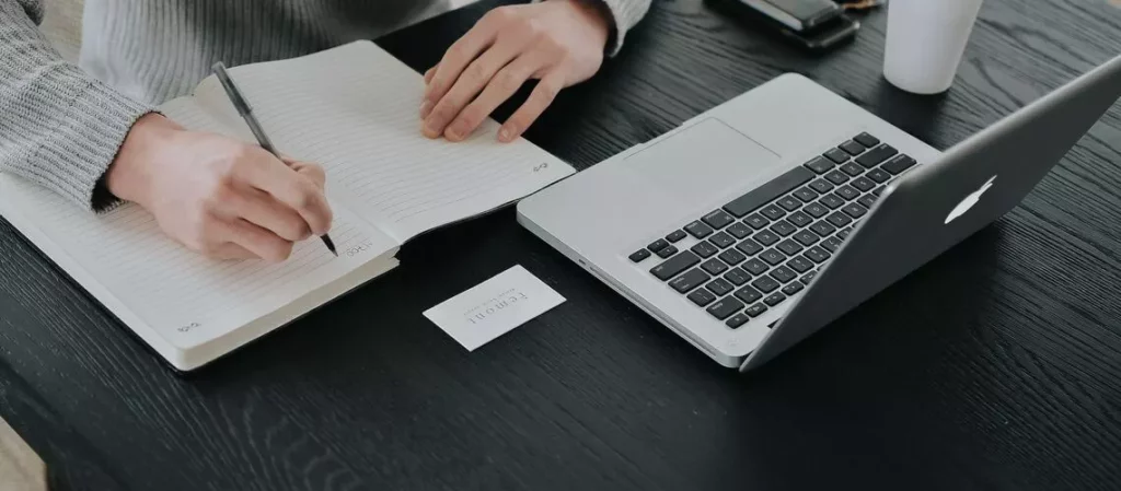 A person reviewing a property valuation report and preparing an appeal letter.